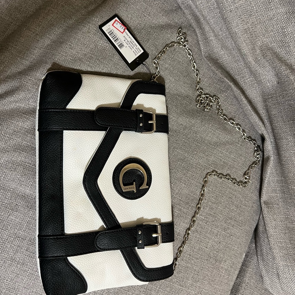 Brand new beautiful over the shoulder Guess purse with tags.